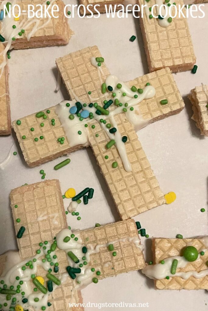 White wafer cookies with white chocolate and green sprinkles on them, shaped like a cross, with the words "No-Bake Cross Wafer Cookies" digitally written on top.