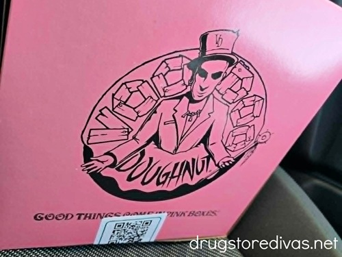 A pink box from Voodoo Doughnuts.