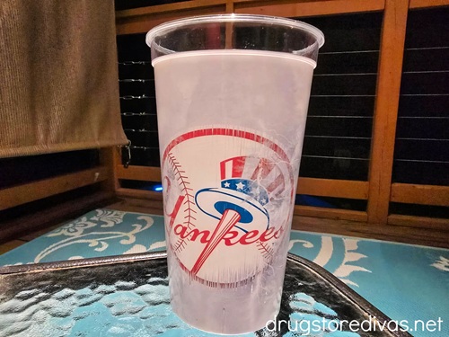 A New York Yankees cup on a table.