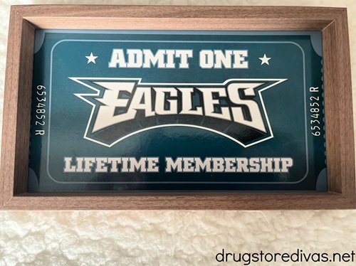 A framed ticket that says "Admit One Eagles Lifetime Membership" on it.