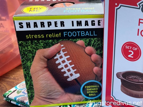 A stress ball, shaped as a football, in a box on a table.
