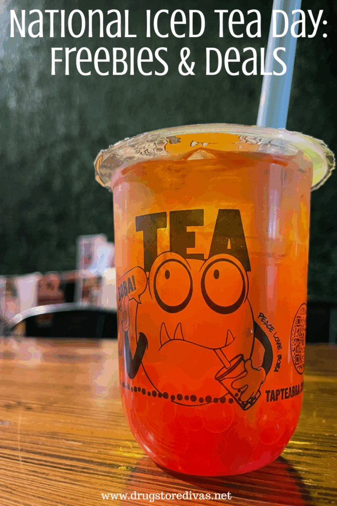 A boba tea drink in a plastic cup with a monster on it on a table with the words "National Iced Tea Day: Freebies & Deals" digitally written above it.