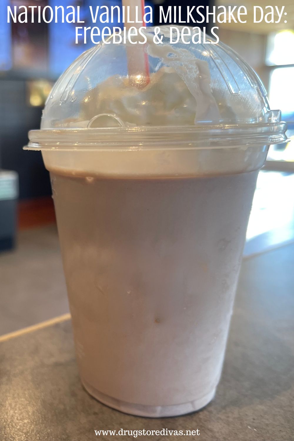 A milkshake on a table in a fast food restaurant with the words 