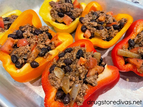 Stuffed pepper halves on a silver tray.