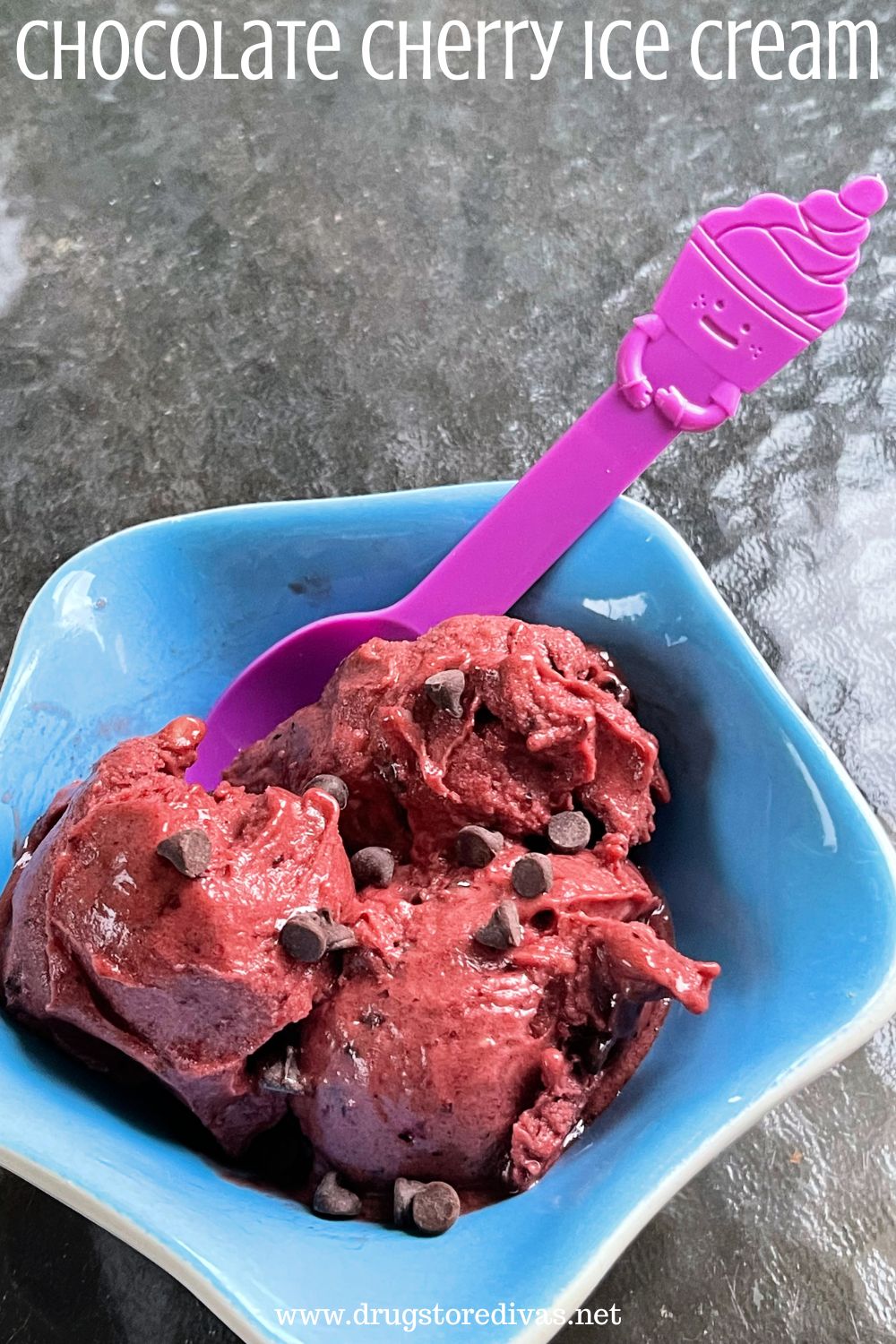 A blue bowl filled with maroon colored ice cream with chocolate chips and a purple spoon it in and the words 