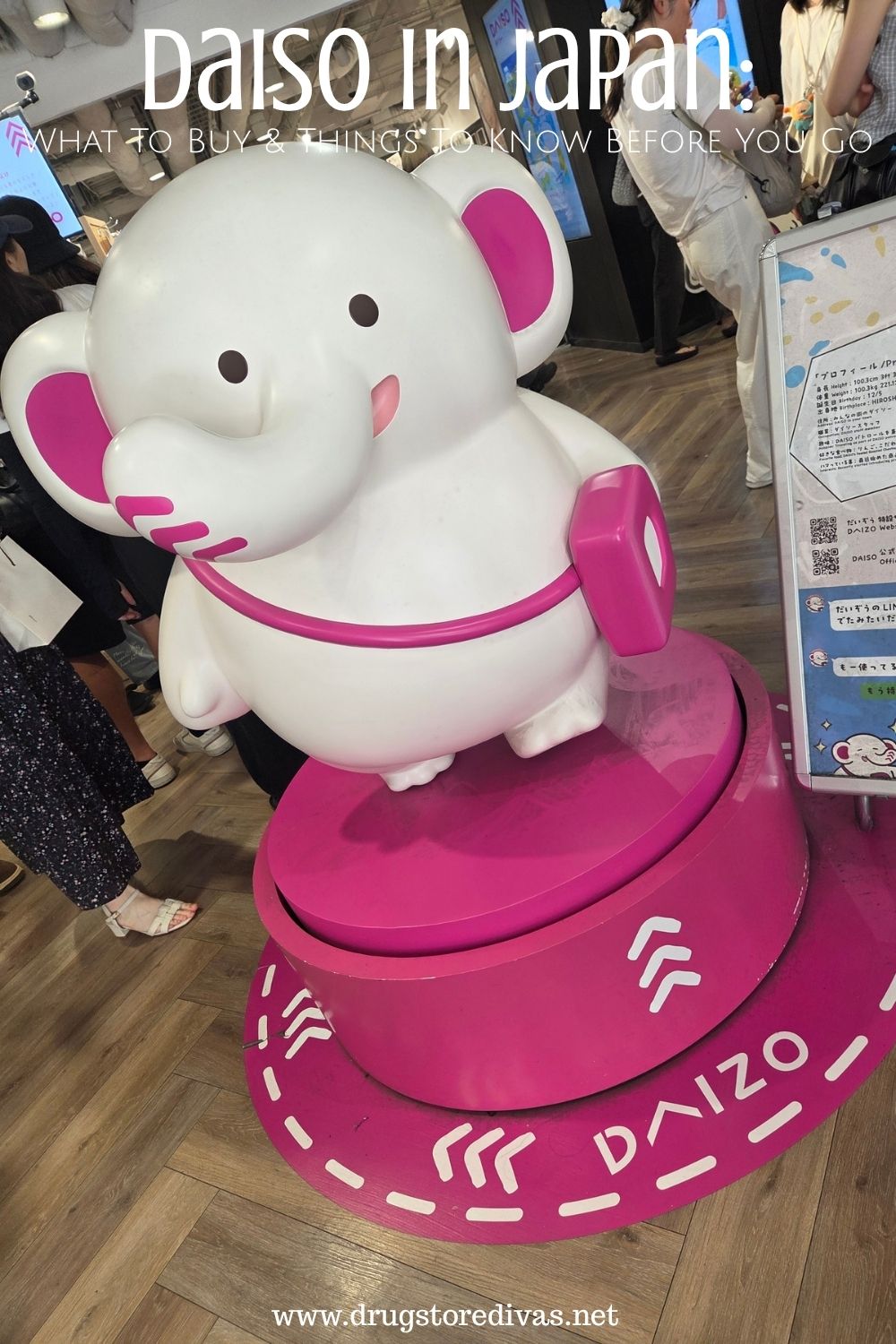 A white elephant on a pink stand in a store with the words 
