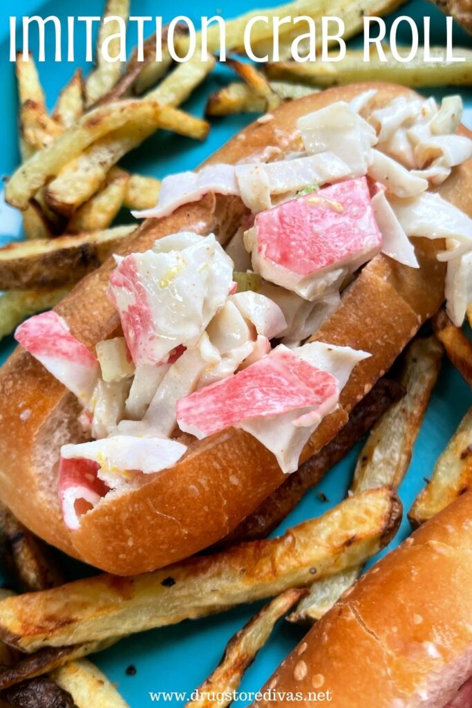 A crab roll on a blue plate surrounded by homemade French fries and the words "Imitation Crab Roll" digitally written on top.