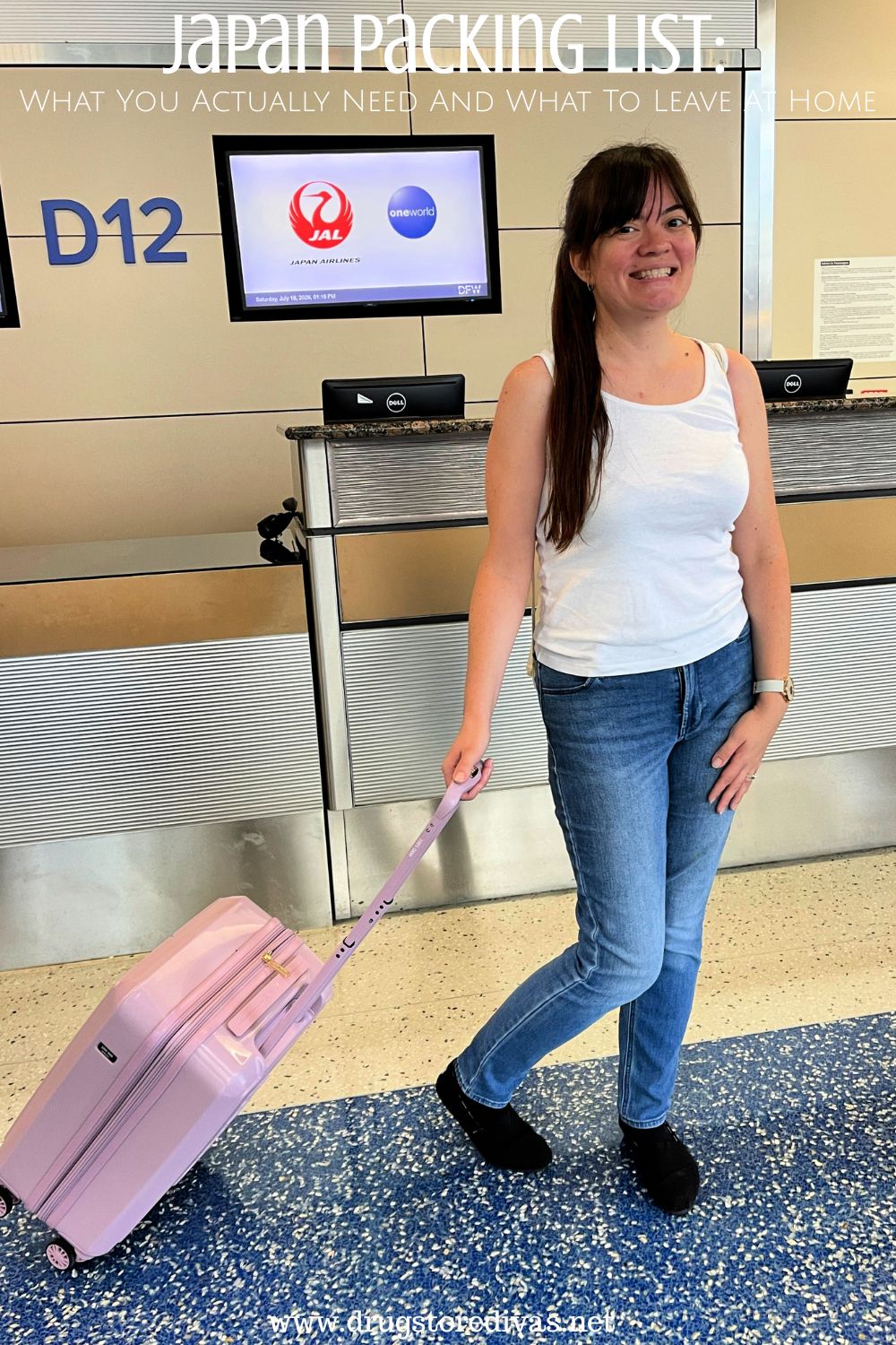 A woman in a white tank top and jeans holding a purple carry on bag in front of a Japan Airlines gate with the words 