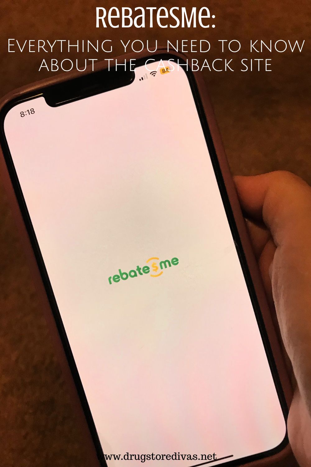 A hand holding a phone with a white screen that says RebatesMe and the words 
