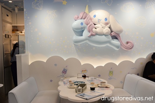 A table with Cinnamoroll riding a unicorn above it at the Cinnamoroll Cafe in Osaka.
