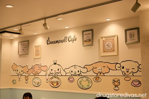 A mural of Cinnamoroll characters eating at the Cinnamoroll Cafe in Osaka.