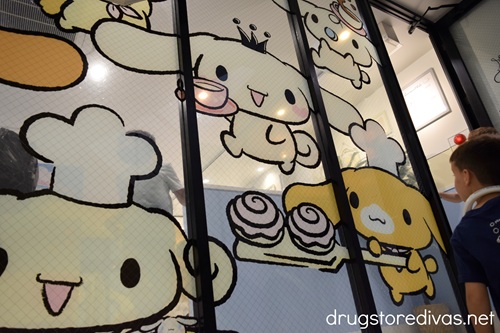 Cinnamoroll characters painted on a window at the entrance of the third floor of Cinnamoroll Cafe in Osaka.