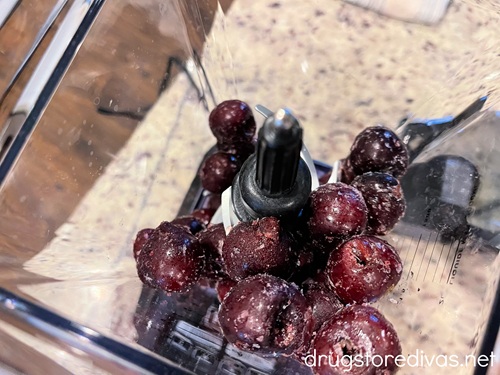 Frozen cherries in a blender.