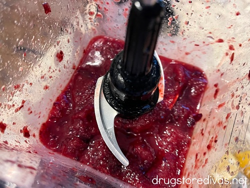 An icy maroon beverage in a blender.
