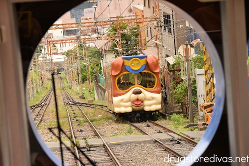 A dog-shaped train on a track at Ikoma Mountain in Japan.
