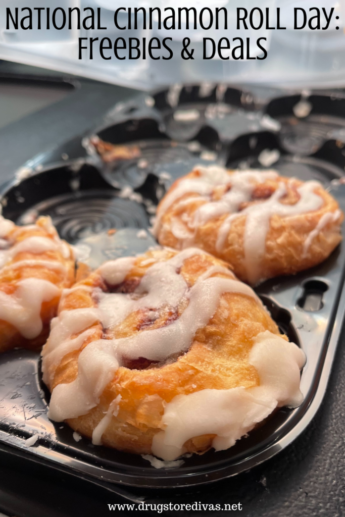 A tray with three cinnamon rolls on it with the words "National Cinnamon Roll Day: Freebies & Deals" digitally written on top.