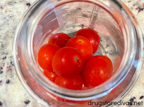 Cherry tomatoes in a glass jar.
