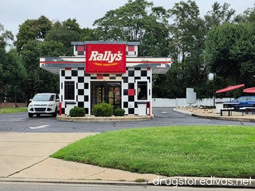 The outside of a Rally's restaurant.