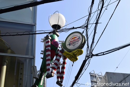 A human-ish-shaped streetlight in Amerikamura, Japan.
