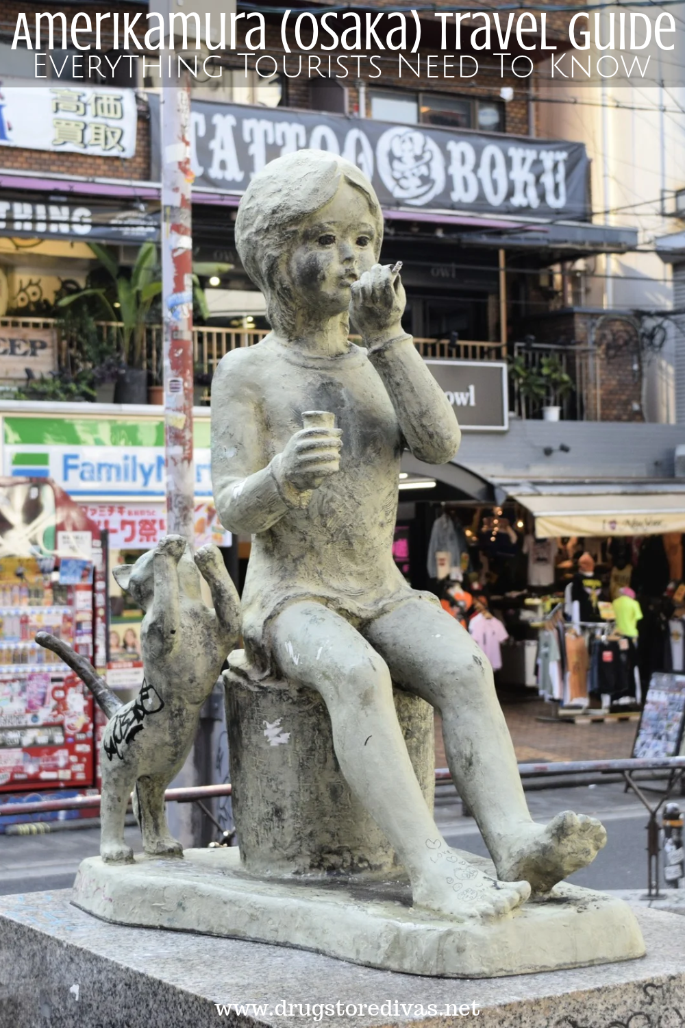 A statue of a child in front of stores with the words 
