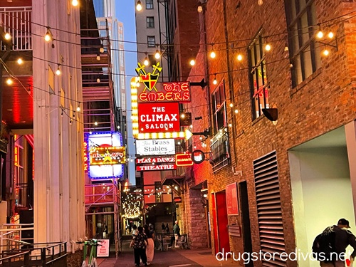 A neon sign advertising The Embers and The Climax Saloon in Printer's Alley in Nashville.